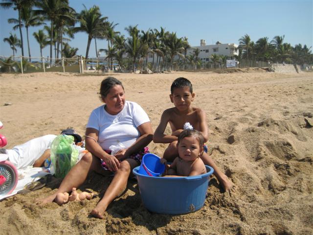 Mexican family enjoying the beach